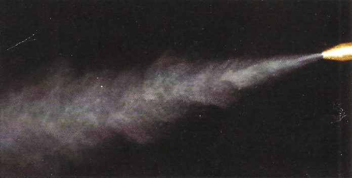 Conventional coolant mister creating a cloud of fog